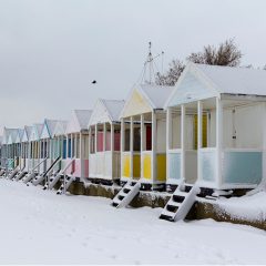 snowy beach huts